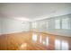 Bright living room with hardwood floors, chandelier, and natural light at 1593 Teague St, Charleston, SC 29407
