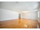 Bright living room with hardwood floors, chandelier, and natural light at 1593 Teague St, Charleston, SC 29407