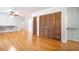 Spacious living room with hardwood floors, closet space and a seamless flow into adjacent areas at 1593 Teague St, Charleston, SC 29407