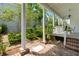 Covered porch overlooking lush garden, offering a peaceful outdoor retreat at 16 Trumbo St, Charleston, SC 29401