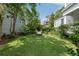 Private backyard with a classic fire pit and lush landscaping, perfect for entertaining guests at 16 Trumbo St, Charleston, SC 29401