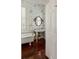 Charming bathroom features a clawfoot tub, pedestal sink, dark wood floors, and patterned wallpaper at 16 Trumbo St, Charleston, SC 29401