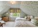 Charming bedroom with floral wallpaper and twin beds, creating a cozy retreat at 16 Trumbo St, Charleston, SC 29401