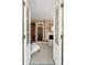 View from doorway of the bedroom with fireplace, patterned area rug, and doorway to additional living space at 16 Trumbo St, Charleston, SC 29401