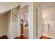View into bedroom featuring pink patterned wallpaper with daybed and a glimpse of the ensuite bath at 16 Trumbo St, Charleston, SC 29401