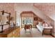Bedroom featuring pink toile wallpaper, writing desk, and daybed at 16 Trumbo St, Charleston, SC 29401