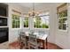 Charming breakfast nook with large windows, natural light, and a cozy dining set at 16 Trumbo St, Charleston, SC 29401
