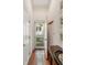 Bright entryway with terracotta tile flooring, white walls, and access to the outdoor area at 16 Trumbo St, Charleston, SC 29401