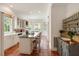 Bright kitchen features an island with seating, modern appliances, and terracotta tile flooring at 16 Trumbo St, Charleston, SC 29401