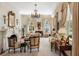 Bright living room features a fireplace, chandelier, and classic furnishings, creating a refined space at 16 Trumbo St, Charleston, SC 29401
