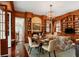 Elegant living room and dining area features beautiful wood trim, built-in bookshelves, and a chandelier at 16 Trumbo St, Charleston, SC 29401