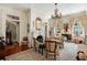 Elegant living room features a fireplace, chandelier, and classic furnishings, creating a refined space at 16 Trumbo St, Charleston, SC 29401