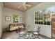 Bright sunroom with tongue and groove ceiling, a ceiling fan, large windows, and elegant furnishings at 16 Trumbo St, Charleston, SC 29401