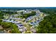 Scenic aerial view of a community featuring beautifully landscaped homes and lush green spaces by the lake and woods at 1723 Bolden Dr, Mount Pleasant, SC 29466