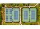 Aerial view of four fenced community tennis courts surrounded by trees at 1723 Bolden Dr, Mount Pleasant, SC 29466