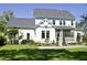 Spacious backyard with lush lawn, manicured landscaping, and a covered porch at 1723 Bolden Dr, Mount Pleasant, SC 29466