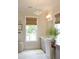 Bright bathroom with natural light, a patterned light fixture, vanity with a sink, and neutral decor at 1723 Bolden Dr, Mount Pleasant, SC 29466