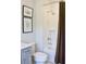 Well-lit bathroom featuring a shower with brown curtain, white tile, and gray vanity at 1723 Bolden Dr, Mount Pleasant, SC 29466