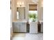 Bathroom area featuring marble floors, dual vanities, and a woven window shade at 1723 Bolden Dr, Mount Pleasant, SC 29466