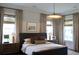 Comfortable bedroom with ample natural light from large windows, complemented by neutral tones and stylish furnishings at 1723 Bolden Dr, Mount Pleasant, SC 29466