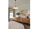 Bedroom features large dressers with decor; the light fixture adds a touch of elegance and charm to the room at 1723 Bolden Dr, Mount Pleasant, SC 29466