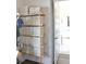 Organized closet with wooden shelves and white storage boxes, through a doorway at 1723 Bolden Dr, Mount Pleasant, SC 29466
