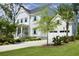 Elegant home with a two-car garage, concrete driveway, manicured lawn, and a charming covered front porch at 1723 Bolden Dr, Mount Pleasant, SC 29466
