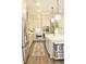 Well-lit kitchen with stainless steel appliances, a marble counter top island, and modern pendant lights at 1723 Bolden Dr, Mount Pleasant, SC 29466