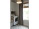 Functional laundry room with white cabinets, a washer, a dryer, and a window at 1723 Bolden Dr, Mount Pleasant, SC 29466