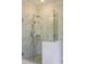Modern glass shower enclosure with marble tile walls and a chrome shower head at 1723 Bolden Dr, Mount Pleasant, SC 29466