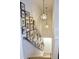 Bright staircase featuring unique star pendant lighting and a curated gallery wall of Gathering photos at 1723 Bolden Dr, Mount Pleasant, SC 29466
