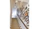 Carpeted staircase with framed photos adorning the wall at 1723 Bolden Dr, Mount Pleasant, SC 29466