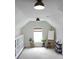 Bright studio space with ample natural light, storage cabinets, and an artist's easel at 1723 Bolden Dr, Mount Pleasant, SC 29466