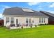 Spacious backyard with patio furniture and solar panels at 175 Basket Grass Ln, Summerville, SC 29486