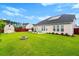 Large backyard with a shed, patio area, and well-maintained lawn at 175 Basket Grass Ln, Summerville, SC 29486