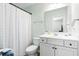 Clean bathroom featuring a white vanity, mirror, and shower with a patterned curtain at 175 Basket Grass Ln, Summerville, SC 29486