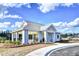 View of the community's outdoor clubhouse, featuring an entertainment area and playground at 175 Basket Grass Ln, Summerville, SC 29486
