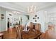 Elegant dining room with hardwood floors, a chandelier, and seating for six at 175 Basket Grass Ln, Summerville, SC 29486