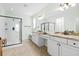Bathroom with a glass shower and white vanity with granite countertop and double sinks at 175 Basket Grass Ln, Summerville, SC 29486