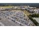 An aerial view showing a school parking lot at full capacity next to a large educational facility at 175 Basket Grass Ln, Summerville, SC 29486