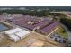 Aerial view of the community school, showing ample parking, athletic fields, and a bus drop off at 175 Basket Grass Ln, Summerville, SC 29486