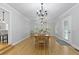 Bright dining room with hardwood floors, a chandelier, and large windows at 189 Fox Chase Dr, Goose Creek, SC 29445