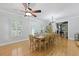Bright dining room with wood floors, chandelier, and shuttered windows provides the perfect space for meals and entertaining at 189 Fox Chase Dr, Goose Creek, SC 29445