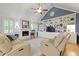 Bright living room boasts hardwood floors, built-in shelving, and a cozy fireplace at 189 Fox Chase Dr, Goose Creek, SC 29445