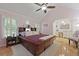 Tranquil main bedroom featuring vaulted ceiling, unique wood frame bed, and en-suite bathroom offering a private retreat at 189 Fox Chase Dr, Goose Creek, SC 29445