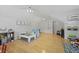 Spacious playroom with hardwood floors, ceiling fans, and plenty of room to play at 189 Fox Chase Dr, Goose Creek, SC 29445