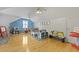 Spacious playroom with hardwood floors, ceiling fans, and lots of room to play at 189 Fox Chase Dr, Goose Creek, SC 29445