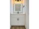 Stylish half bathroom featuring a quartz vanity, illuminated mirror, and modern light fixture at 1906 Gumwood Blvd, North Charleston, SC 29406