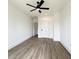 Spacious, bright bedroom with ceiling fan, smooth ceiling, and adjacent doors offering a calm living style at 1906 Gumwood Blvd, North Charleston, SC 29406