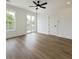 Spacious bedroom filled with natural light, ceiling fan, door, and access to an outdoor balcony at 1906 Gumwood Blvd, North Charleston, SC 29406
